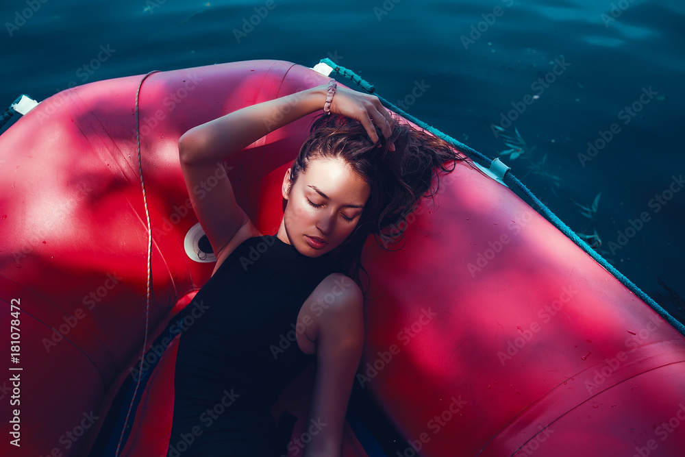 Sexy Woman in black swimming suit in a boat, beautiful tan, girl pretty wet hair  style, slim body woman Stock Photo | Adobe Stock