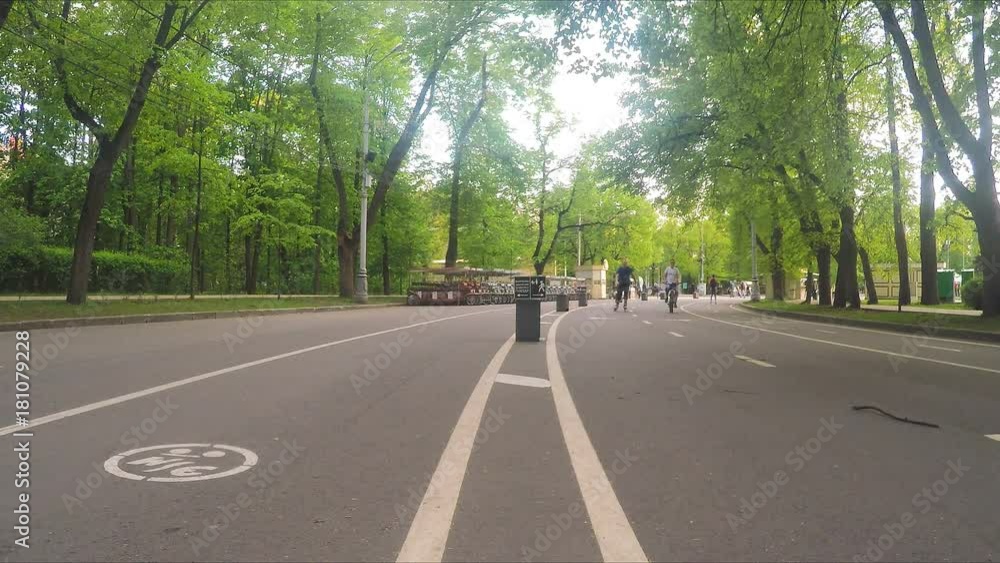 Bicycle Path with people In Summer City Park Bicycle Path with people In Summer City Park