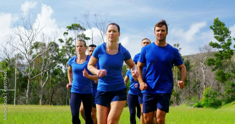 Fit people jogging in boot camp Fit people jogging in boot camp
