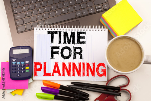 Time For Planning text in the office with surroundings such as laptop, marker, pen, stationery, coffee. Business concept for Business time white background with copy space