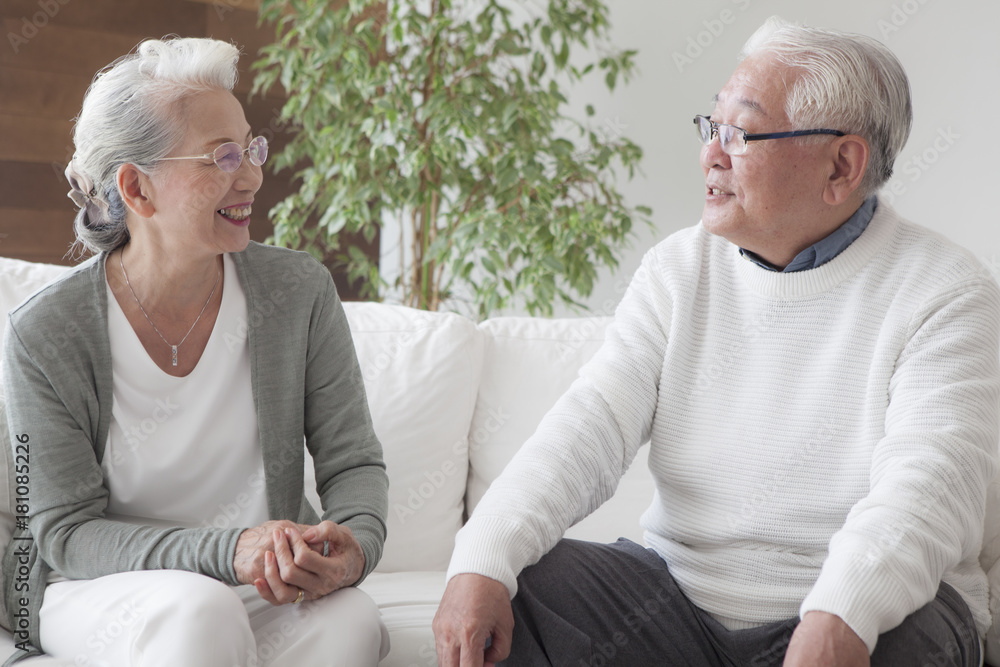 An old couple talking with each other happily An old couple talking with each other happily