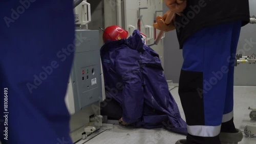 Workers learn to act properly if their partner is struck by an electric shock and the person has lost consciousness. photo