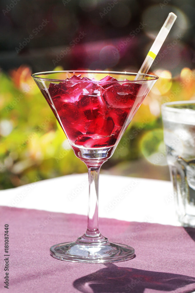 a glass of red jelly for serving