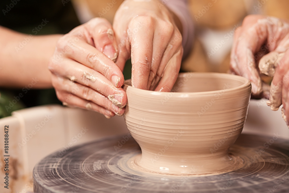 woman potter teaches