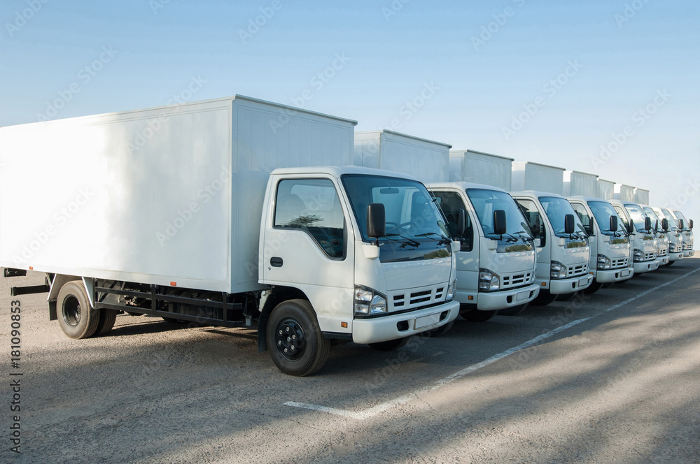 closeup of trucks lined up. park trucks. place for text closeup of trucks lined up. park trucks. place for text
