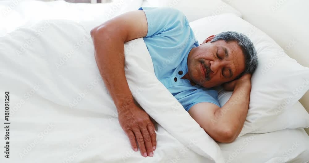 Senior man sleeping peacefully on bed Senior man sleeping peacefully on bed