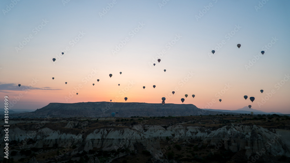 silhouettes of hot air balloons in Cappadocia, Turkey