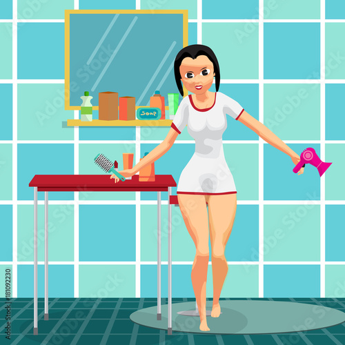 Woman drying her hair with hairdryer in bathroom standing in fro