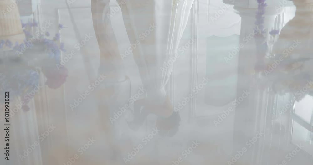 bride and groom hold hands and look each other in the eye bride and groom hold hands and look each other in the eye