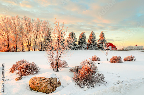 Winter sunset near the red barn