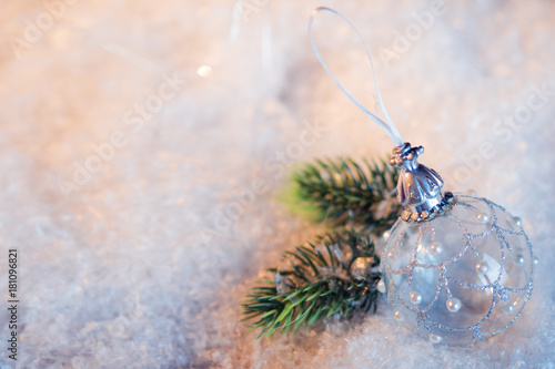 Happy new year. Christmas ball on the snow festive background © Ulia Koltyrina