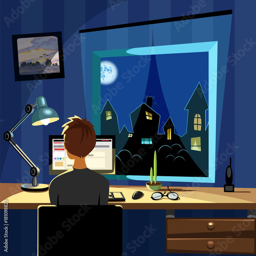 the teenager sitting at the computer table