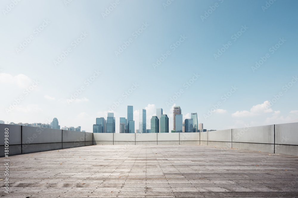 Fototapeta premium empty brick floor with modern cityscape