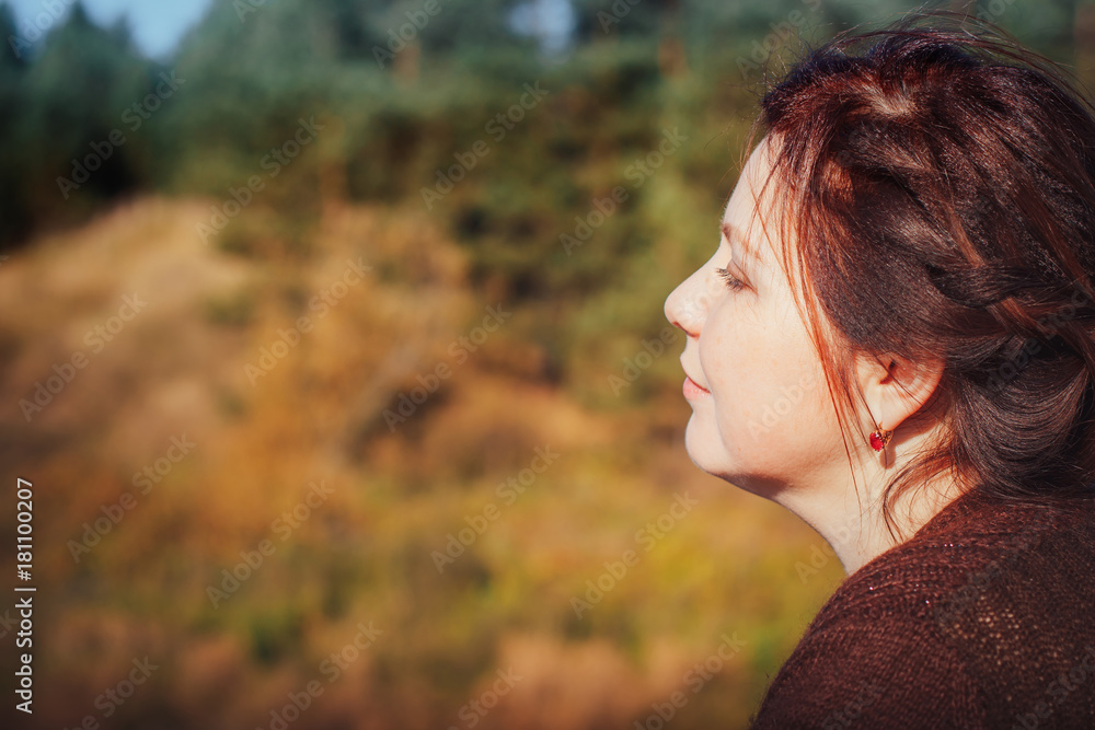 Woman in a forest in an autumn Woman in a forest in an autumn