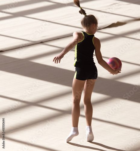 girl with a ball on a professional gymnast