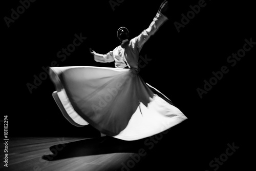 the image of a whirling Dervish in the darkness
