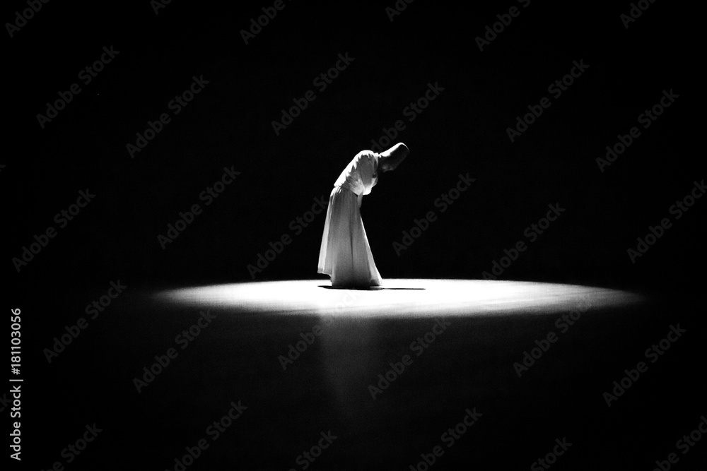 Naklejka premium the image of a whirling Dervish in the darkness