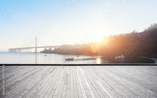Photography empty brick floor with gold gate bridge with sunbeam