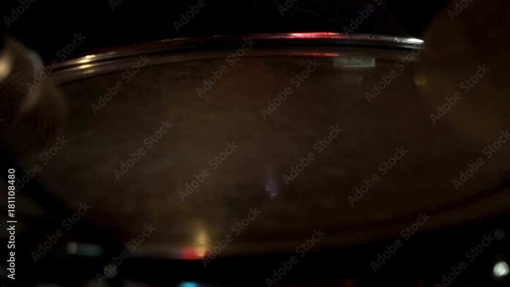 Drummer hand with drumstick playing drum set on rock concert on stage Drummer hand with drumstick playing drum set on rock concert on stage