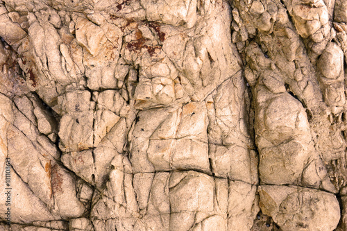 Rock texture and surface background. Cracked and weathered natural stone background.