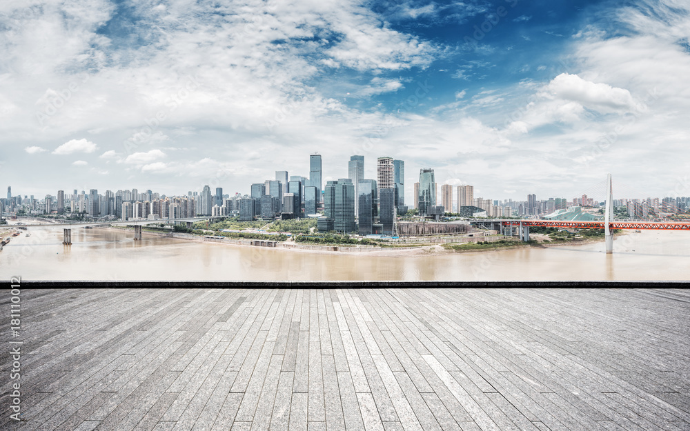 Fototapeta premium empty brick floor with modern cityscape