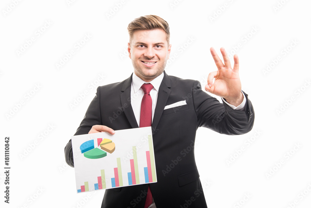 Portrait of business man holding graphs showing ok Portrait of business man holding graphs showing ok