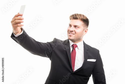Business man taking selfie with smartphone