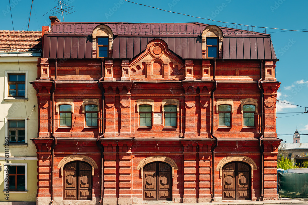 Facade of an old red brick building Facade of an old red brick building