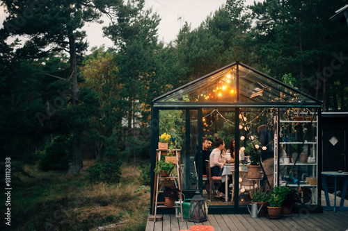 People having party in greenhouse photo