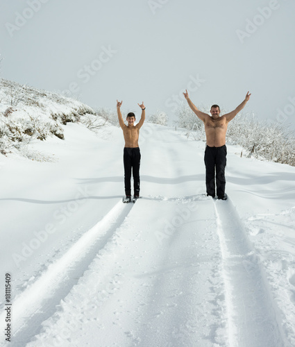  Father and son in mountain snow landscape © vbaleha