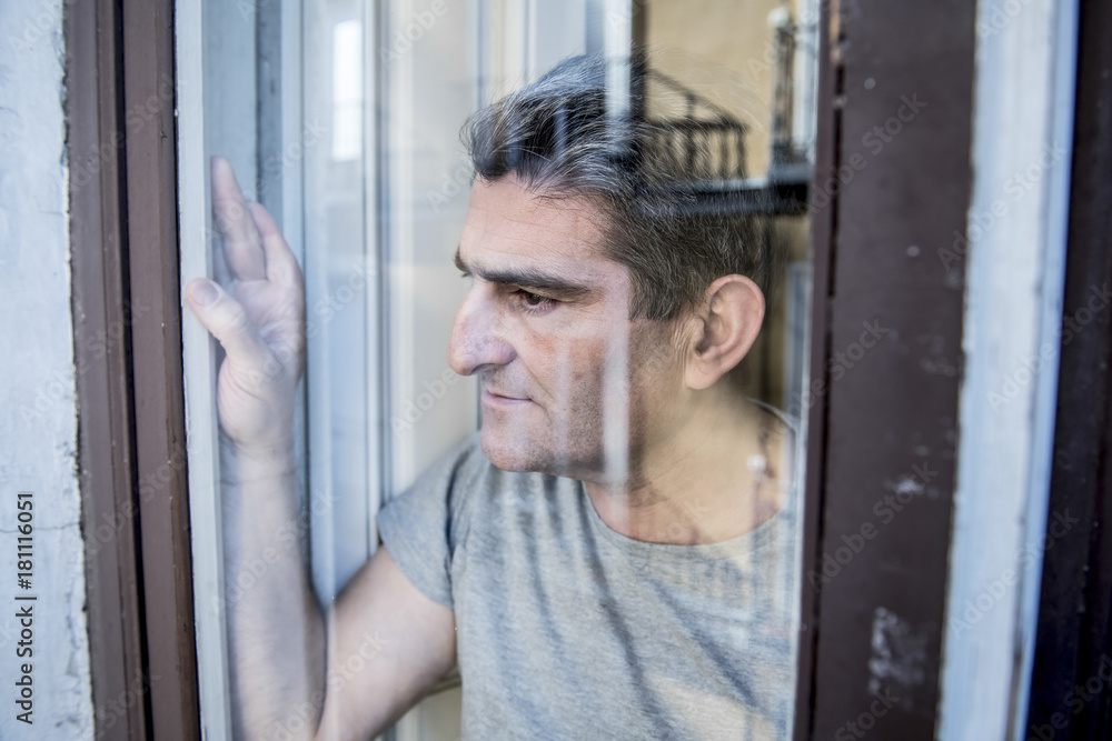 close up portrait of sad and depressed 40s man looking through w close up portrait of sad and depressed 40s man looking through w