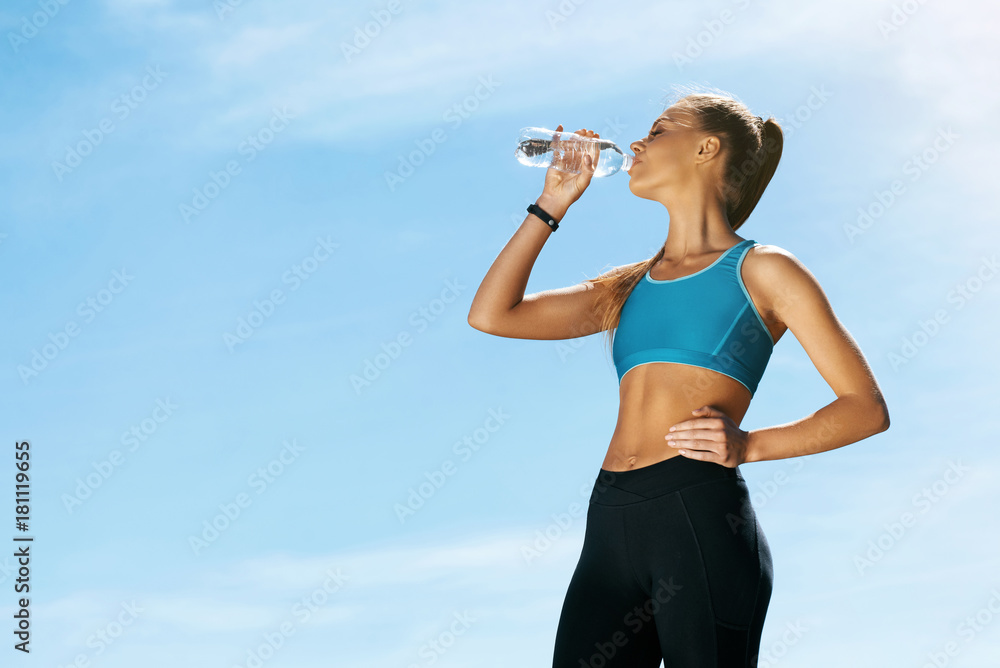 Woman Drinking Water After Running. Woman Drinking Water After Running.