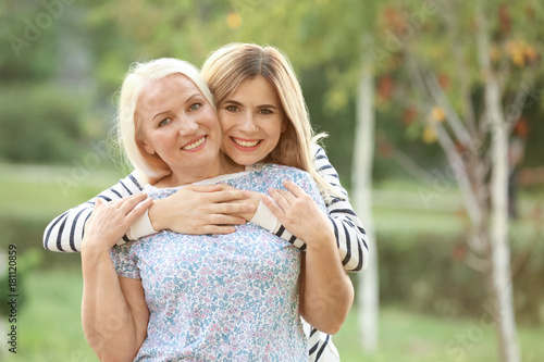 Young woman with elderly mo...