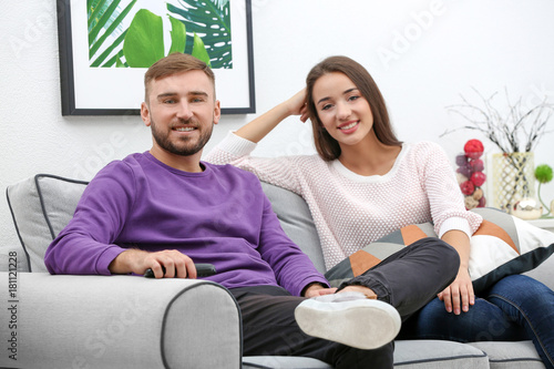 Young couple on sofa at home