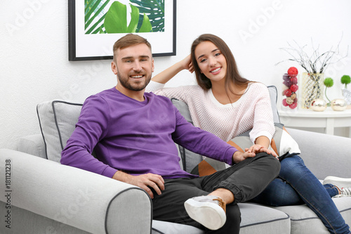 Young couple on sofa at home