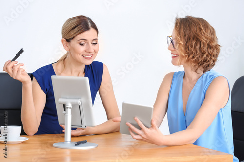 Young woman consulting cust...