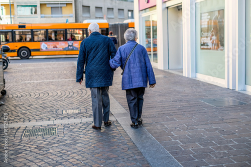 old pensioners couple are working in the city
