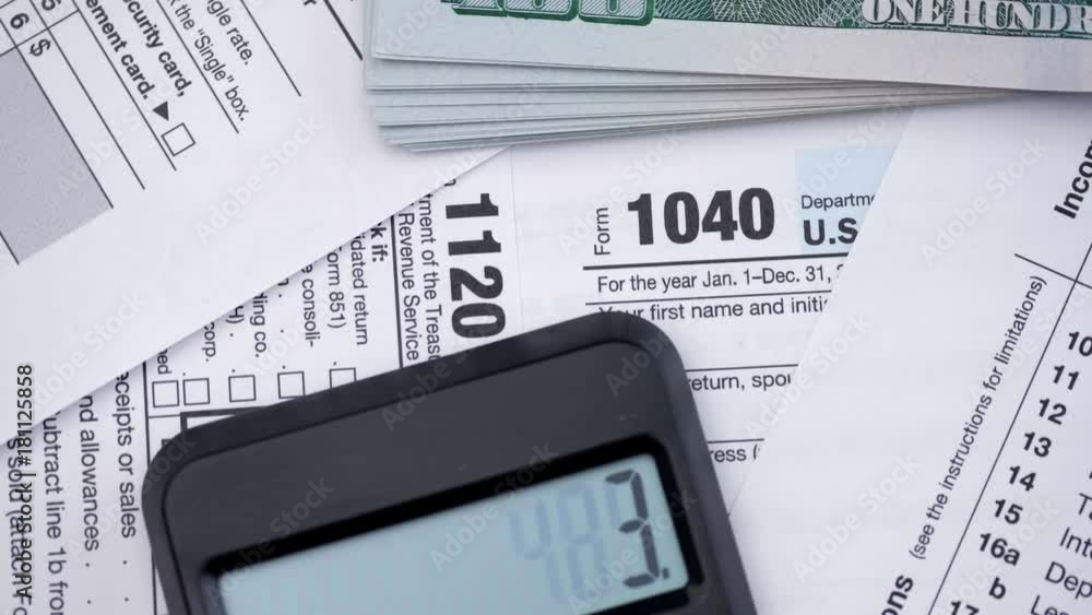 Tax forms 1120, 1040, pen, dollar bills, and calculator. High angle view.
Tax forms 1120, 1040, pen, dollar bills, and calculator. High angle view.