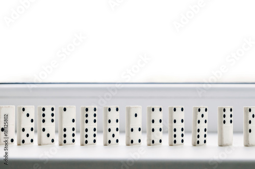 White domino, domino principle, on white background