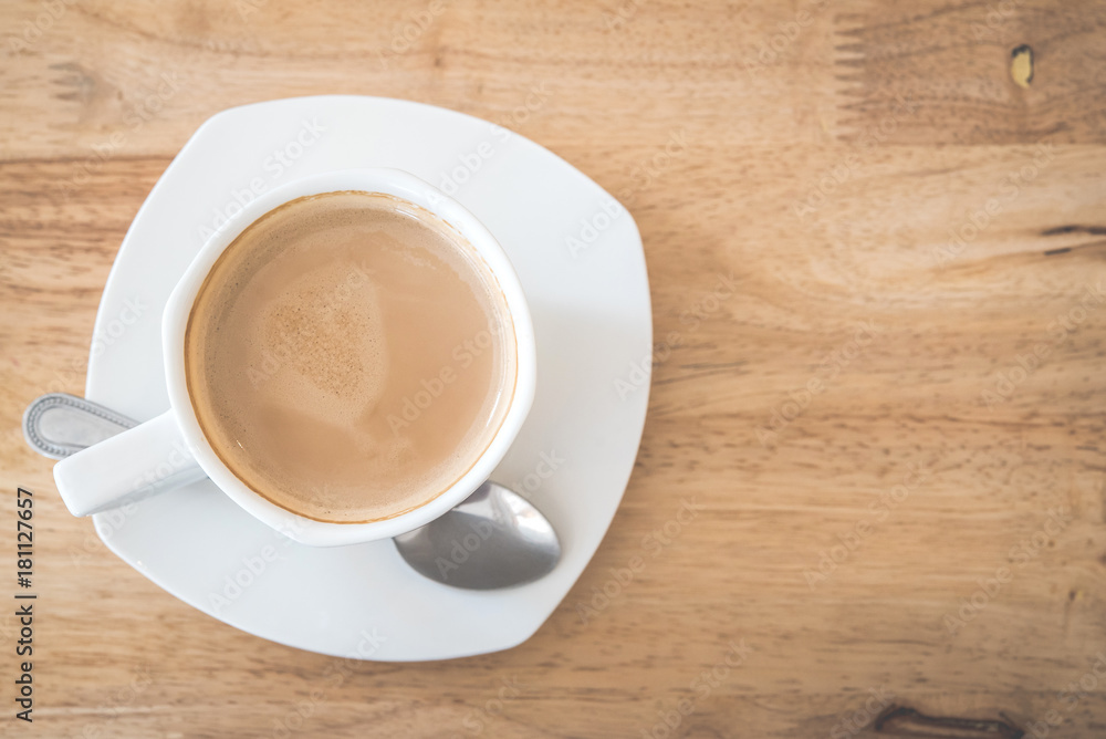 Top view of hot coffee latte on wood table background. Top view of hot coffee latte on wood table background.