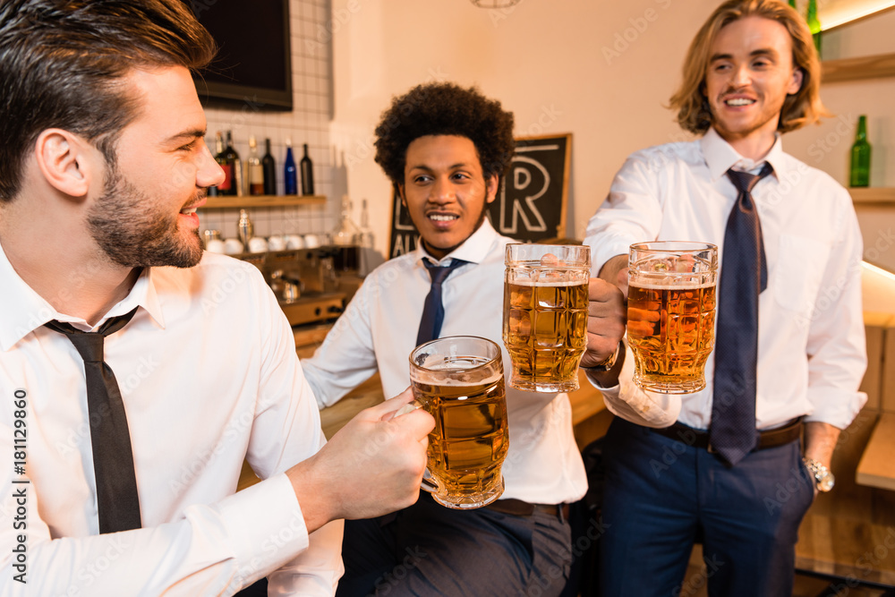 businessmen drinking beer in bar businessmen drinking beer in bar