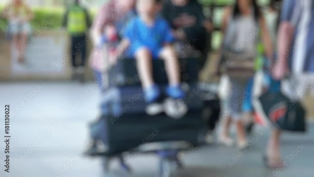 Blurred background with travelers pulling suitcase from airport terminal on Koh Samui in slow motion. 1920x1080 Blurred background with travelers pulling suitcase from airport terminal on Koh Samui in slow motion. 1920x1080