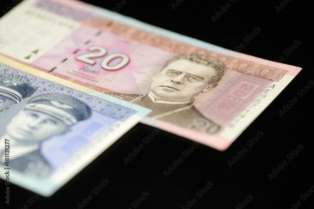Banknotes of ten and twenty Lithuanian litas on a dark background Banknotes of ten and twenty Lithuanian litas on a dark background