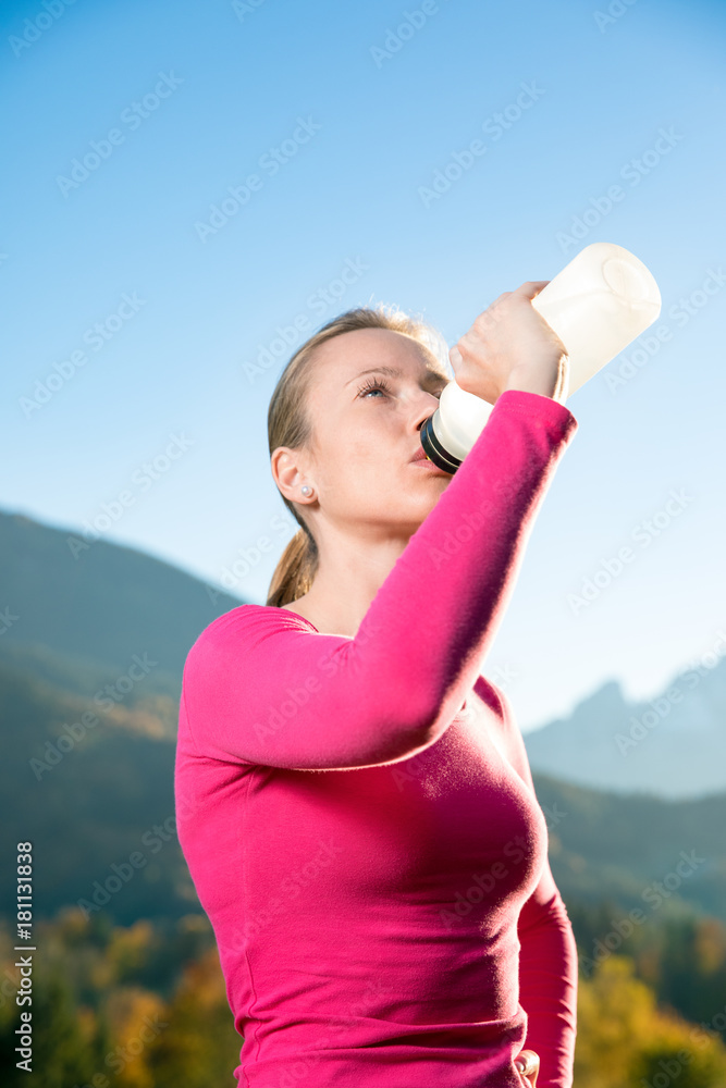 Young, sexy woman runs through a colorful autumn forest in the mountains - she is doing her running workout outdoor at a beautiful sundown and a amazing landscape Young, sexy woman runs through a colorful autumn forest in the mountains - she is doing her running workout outdoor at a beautiful sundown and a amazing landscape