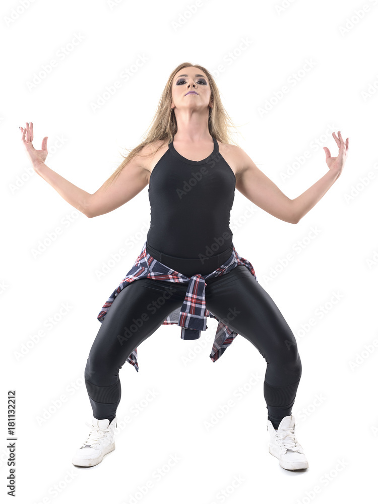 Woman jazz dancer performer posture with arms raised and head back looking at camera. Full body length portrait isolated on white background. Woman jazz dancer performer posture with arms raised and head back looking at camera. Full body length portrait isolated on white background.