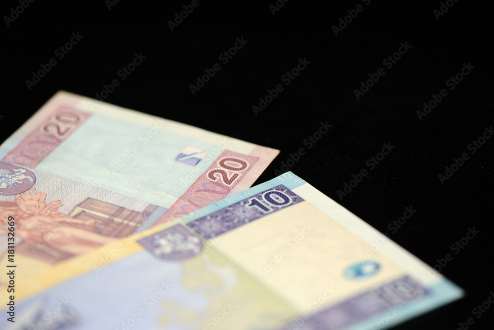 Banknotes of ten and twenty Lithuanian litas on a dark background Banknotes of ten and twenty Lithuanian litas on a dark background
