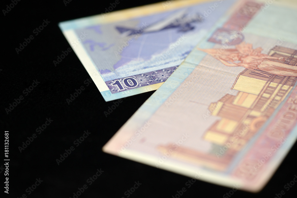 Banknotes of ten and twenty Lithuanian litas on a dark background Banknotes of ten and twenty Lithuanian litas on a dark background