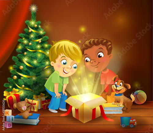 Christmas miracle - boys opening a magic gift beside a Christmas tree