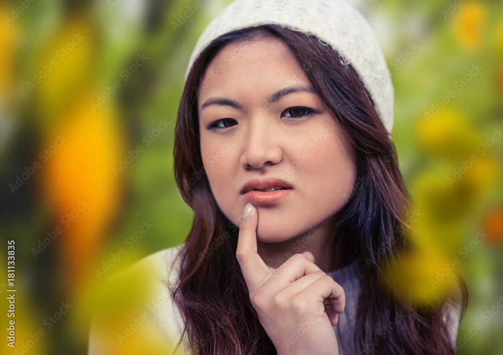 Woman's face in forest with leaves Woman's face in forest with leaves