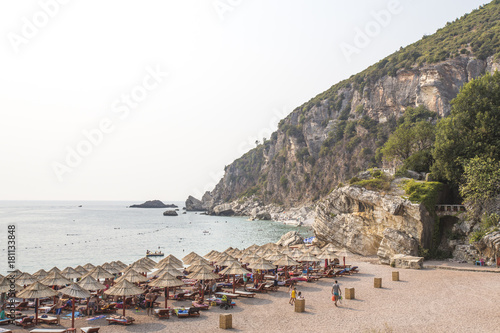 Rocky coastline, bay, beach. People are sunbathing. Europe. photo